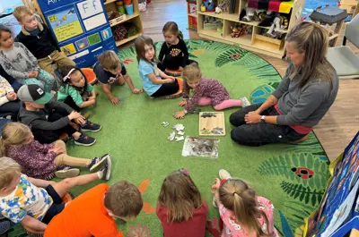 Preschool Kids sitting in a circle for story time