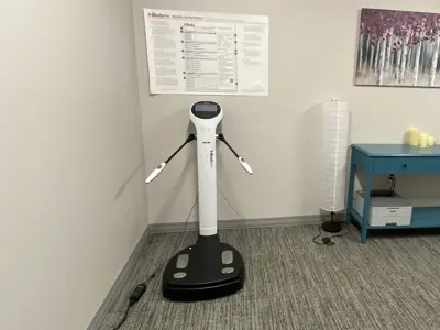 Body composition assessment equipment in a private consultation room.