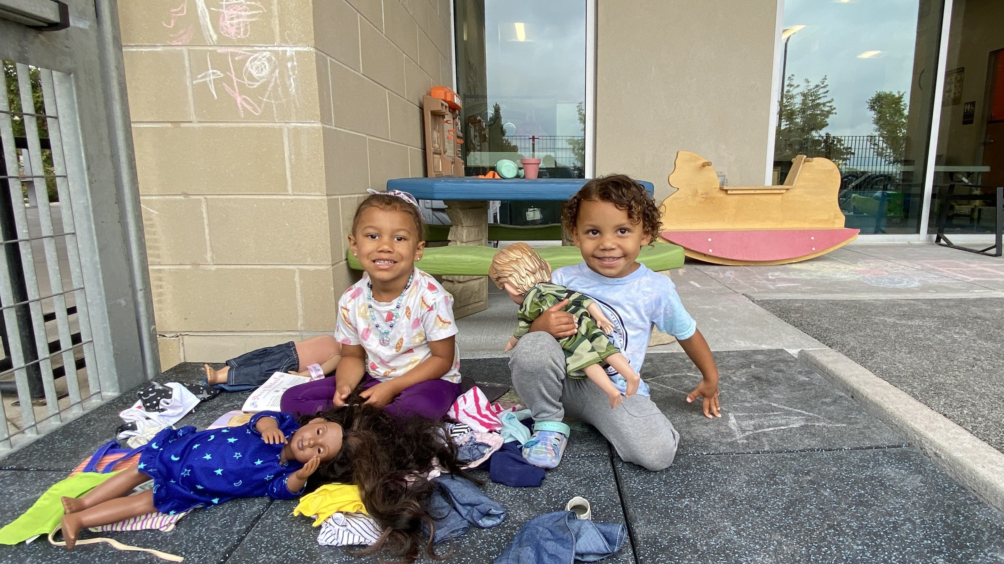 two young kids playing in the child watch program