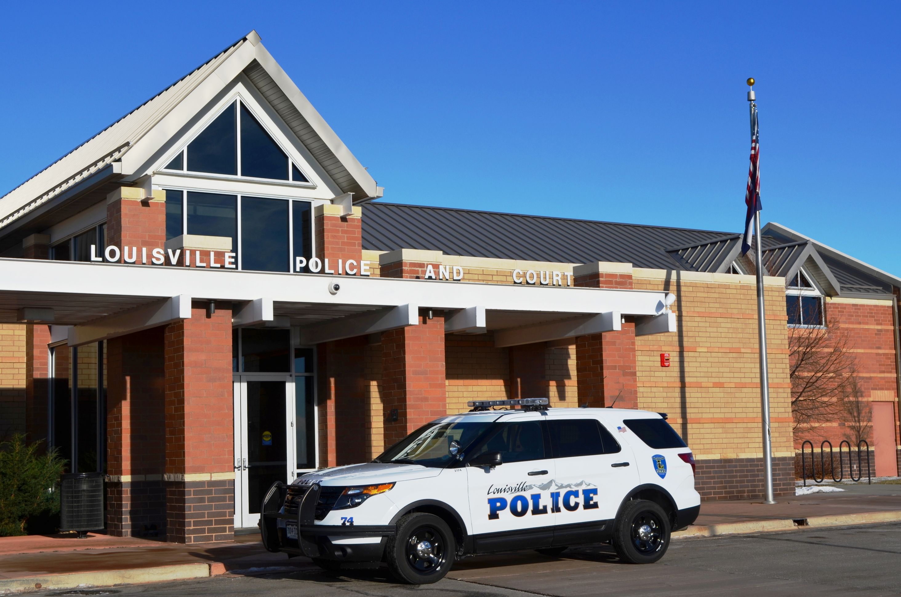 Louisville Police Department car outside a building.